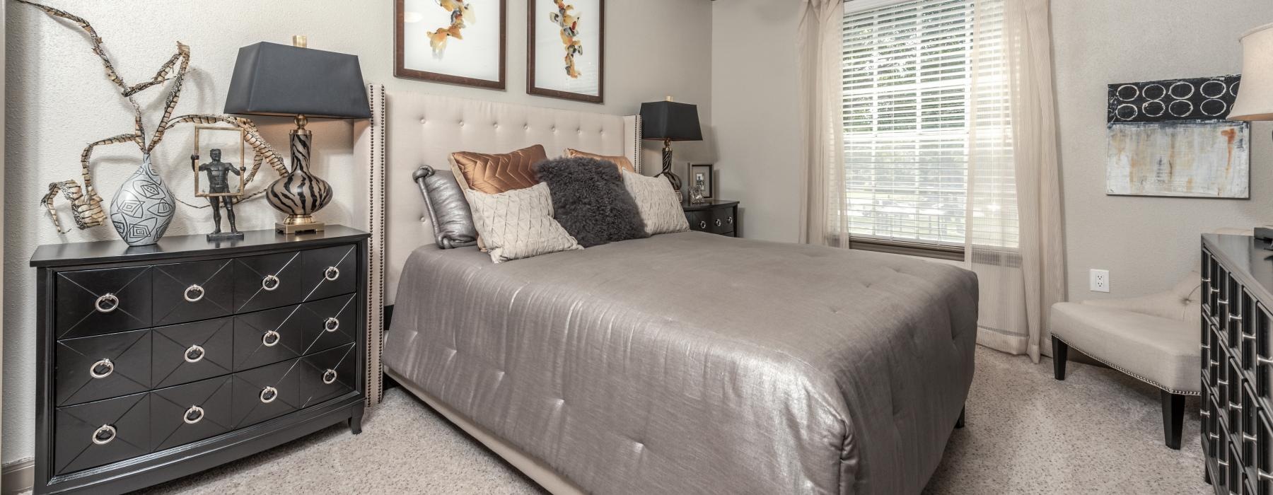 carpeted bedroom with large window