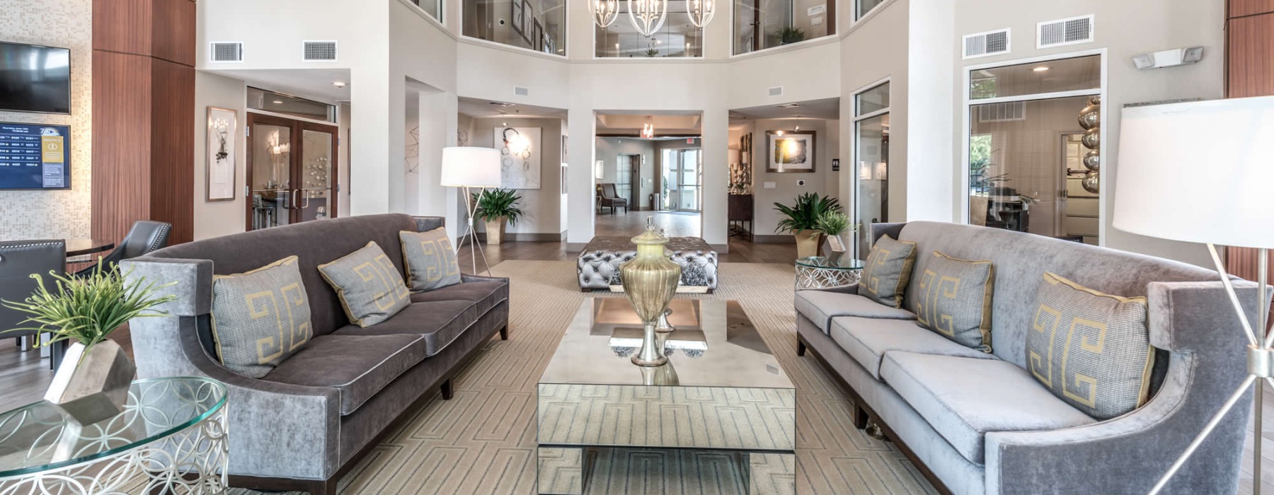 bright clubhouse with high ceilings and couches