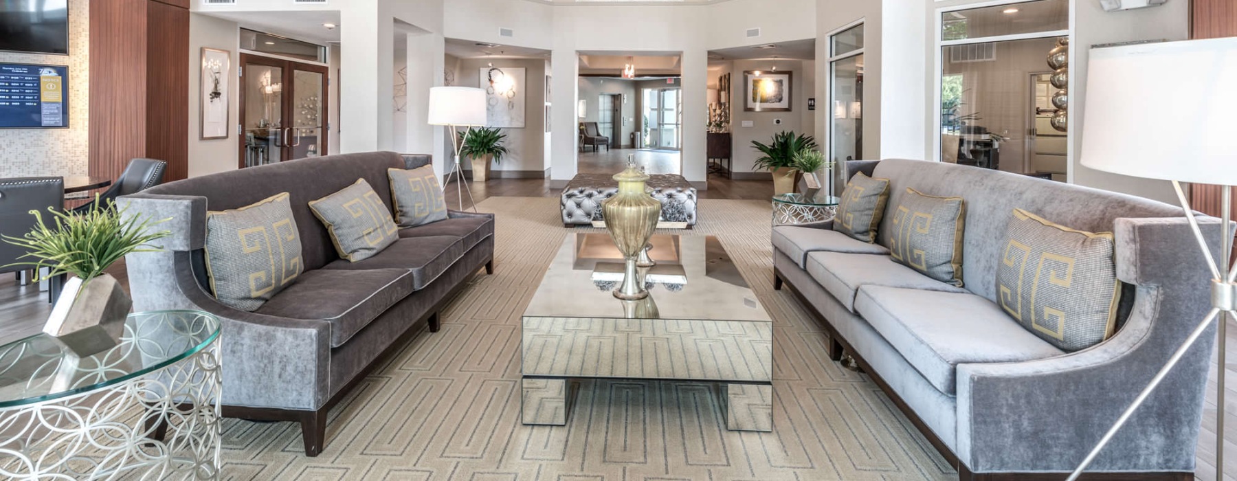 bright clubhouse with high ceilings and couches