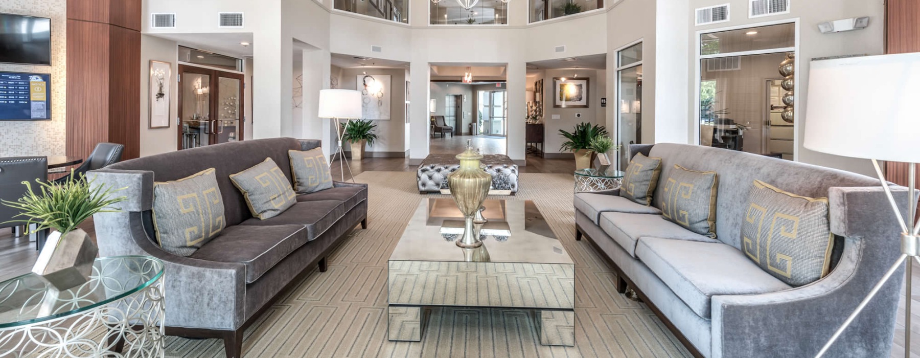 bright clubhouse with high ceilings and couches