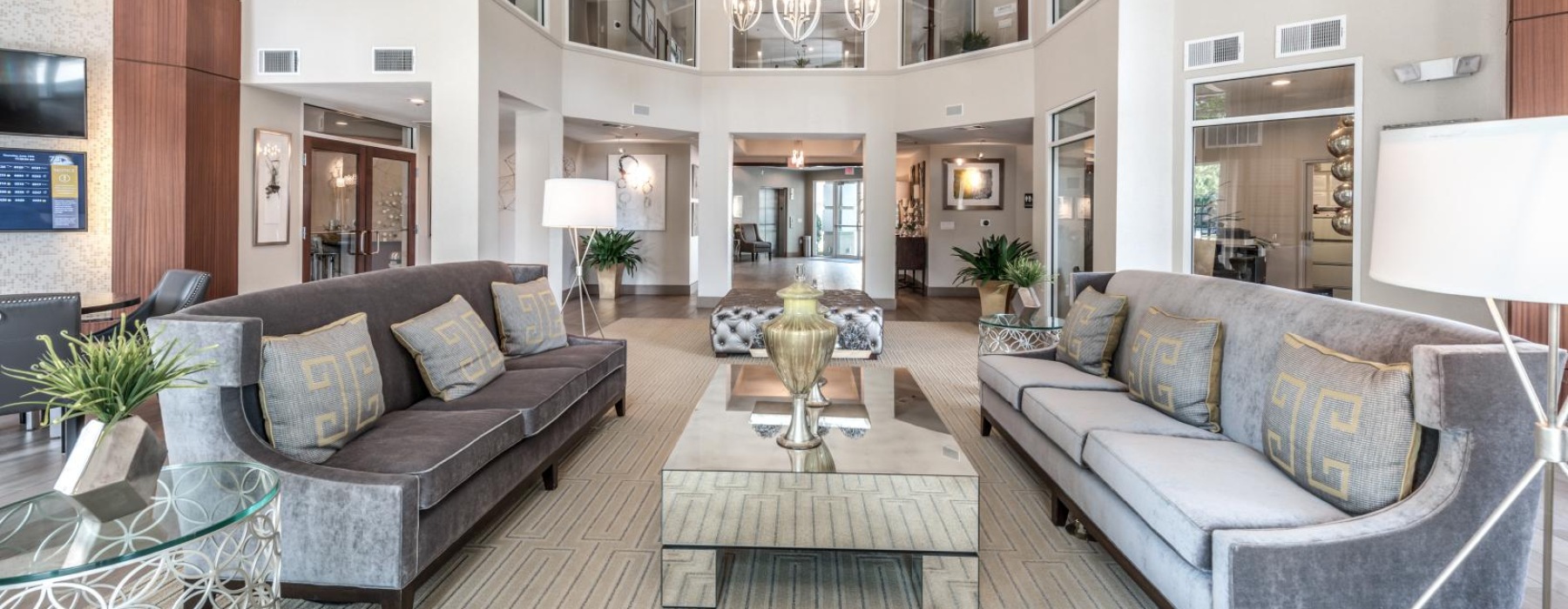bright clubhouse with high ceilings and couches